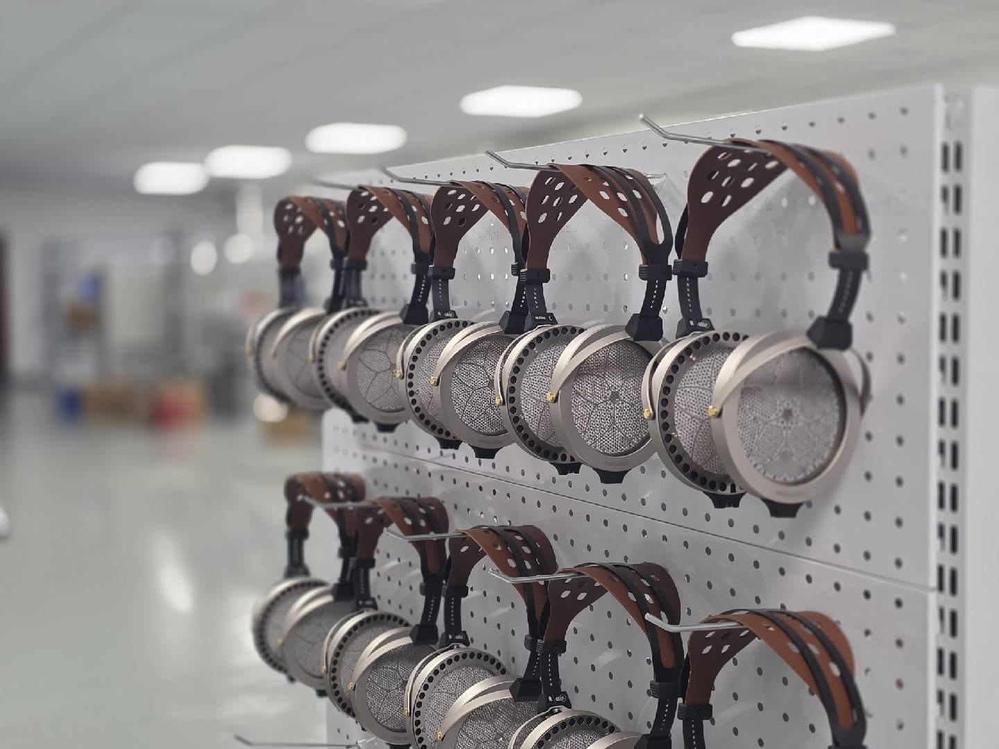 Electrostatic headphones arranged on the production wall